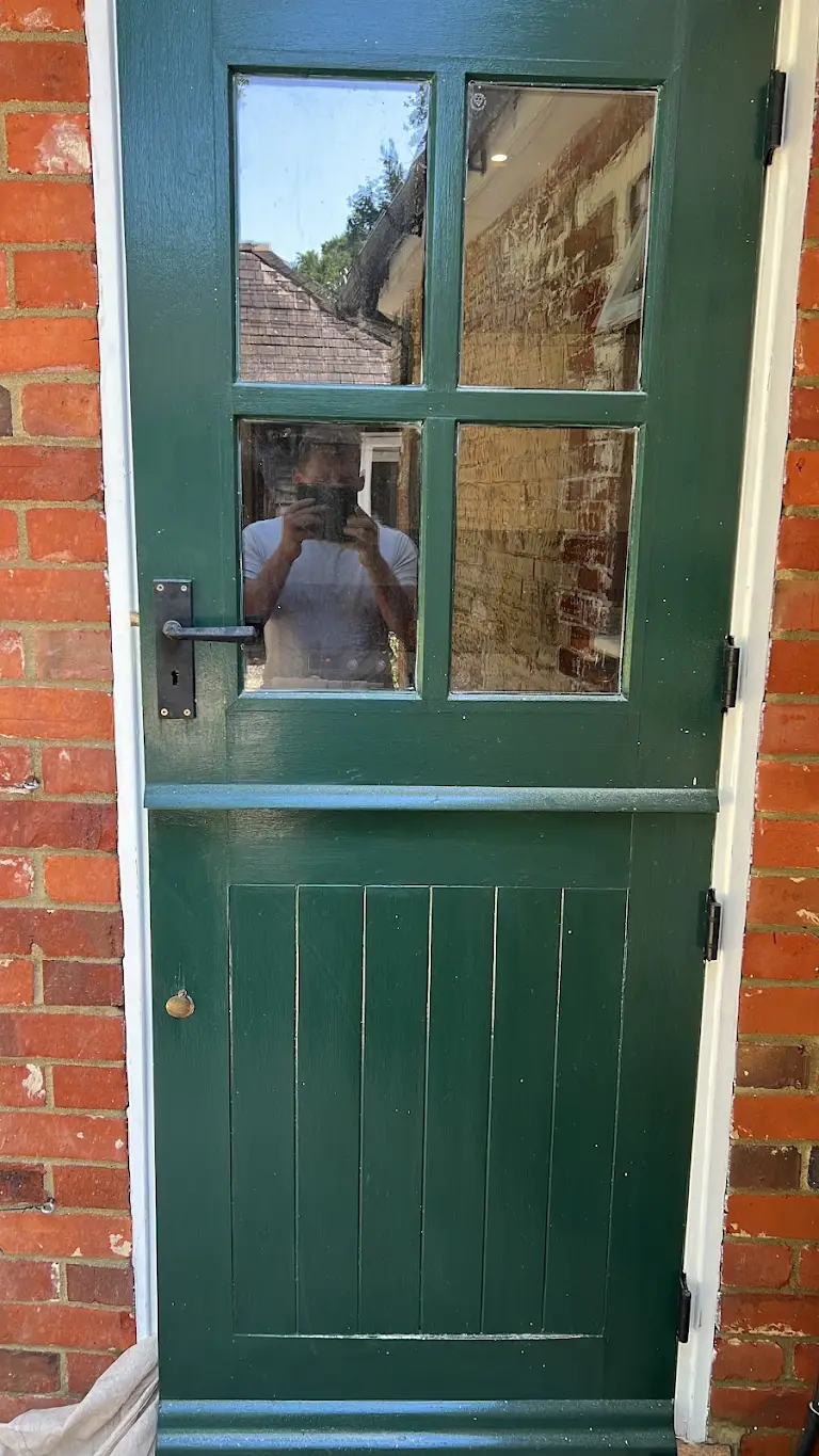 Exterior green door painting with clean finish, residential decorating service