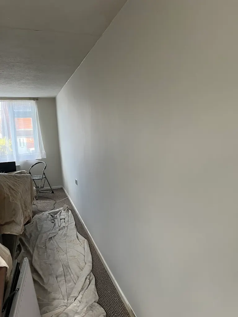 Interior room painting with smooth white walls, clean and modern residential finish