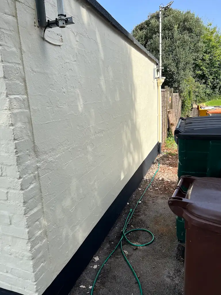 Close-up of freshly painted exterior wall with smooth texture finish